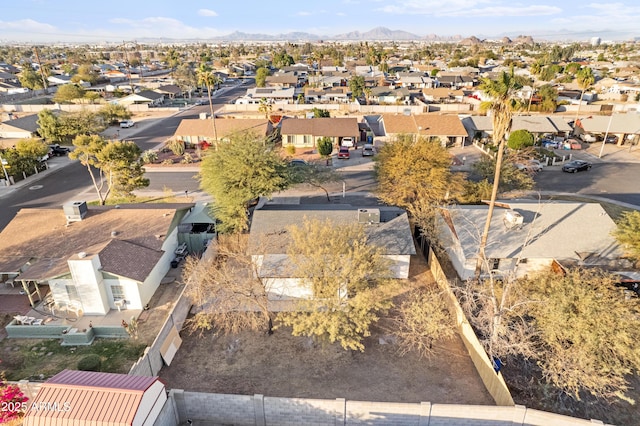 birds eye view of property with a mountain view