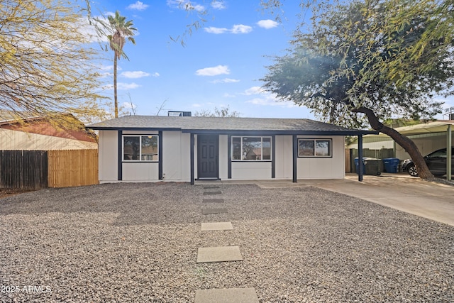 ranch-style home featuring a carport