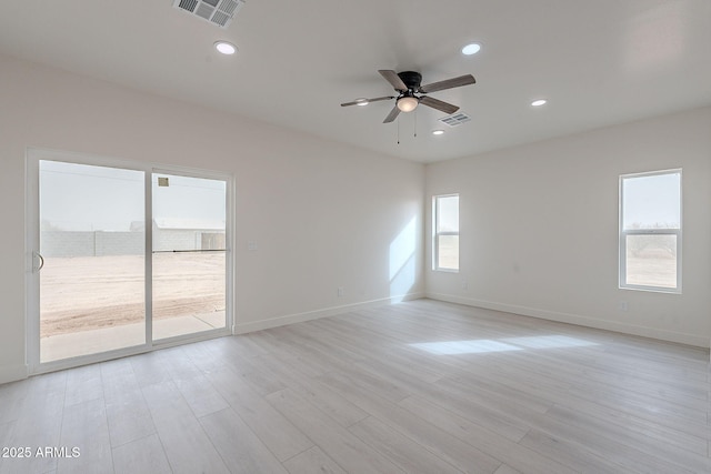 unfurnished room featuring ceiling fan and light hardwood / wood-style flooring