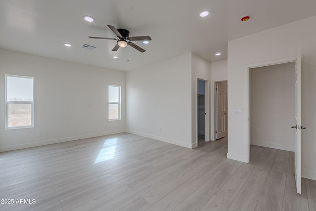 unfurnished bedroom with light hardwood / wood-style flooring and ceiling fan