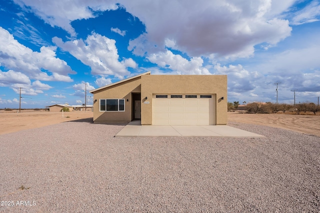 southwest-style home with a garage