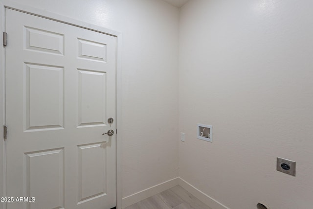 clothes washing area featuring light wood-type flooring, hookup for a washing machine, and electric dryer hookup