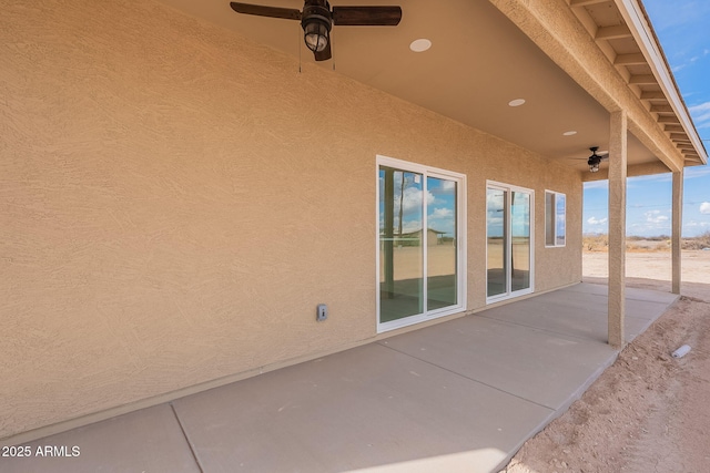 view of patio / terrace featuring ceiling fan