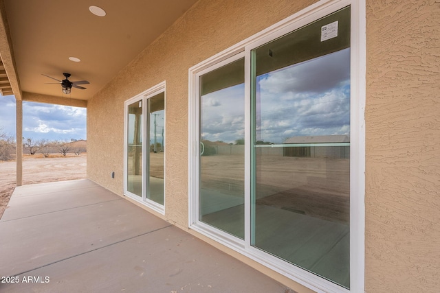 view of patio / terrace featuring ceiling fan