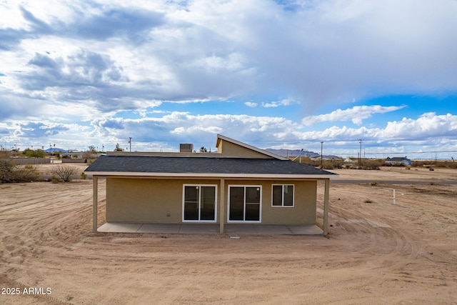 back of property with a patio area