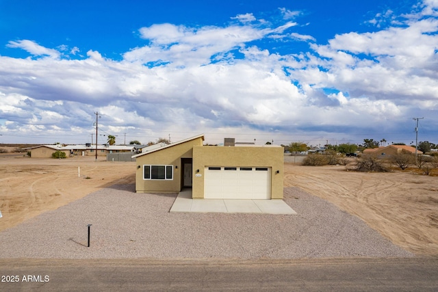 southwest-style home with a garage