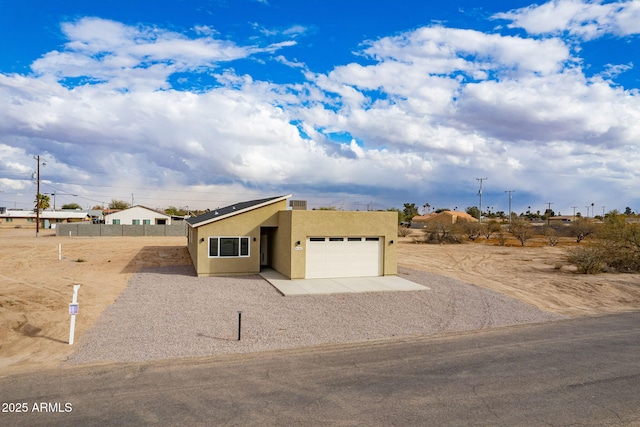 view of front of home featuring a garage