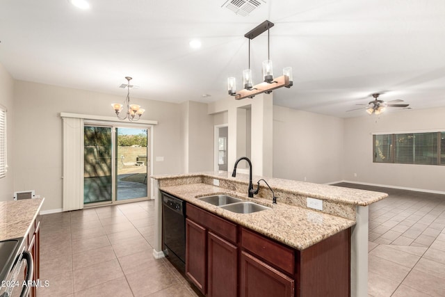 kitchen featuring dishwasher, a kitchen island with sink, sink, and hanging light fixtures