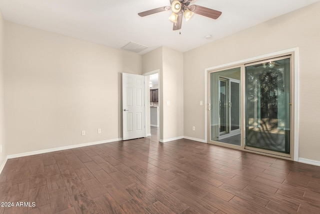 spare room featuring dark hardwood / wood-style floors and ceiling fan