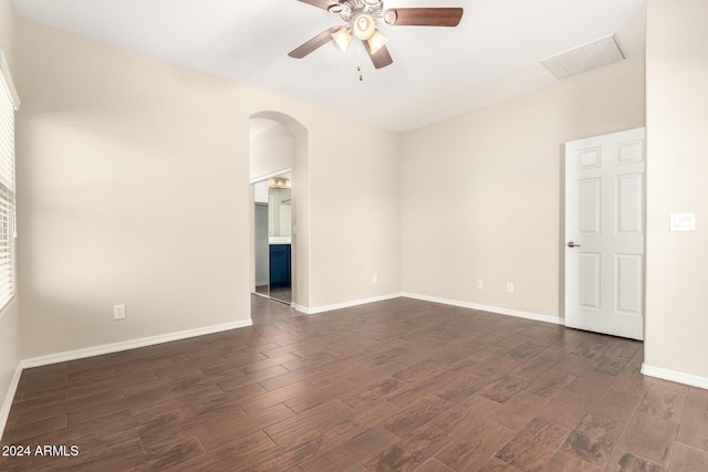 unfurnished room with dark hardwood / wood-style floors and ceiling fan