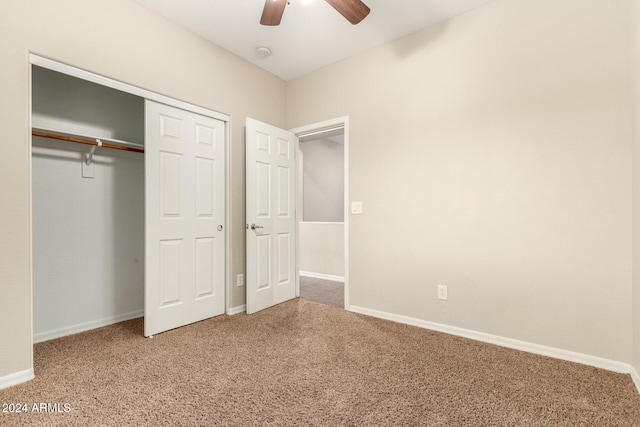 unfurnished bedroom featuring carpet floors, a closet, and ceiling fan