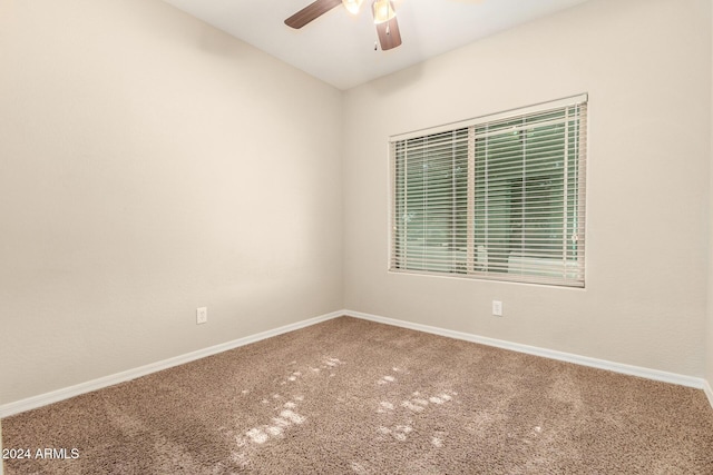 empty room featuring carpet and ceiling fan