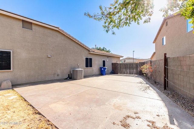 back of house featuring a patio and central AC