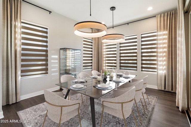 dining room featuring recessed lighting, dark wood-style flooring, and baseboards