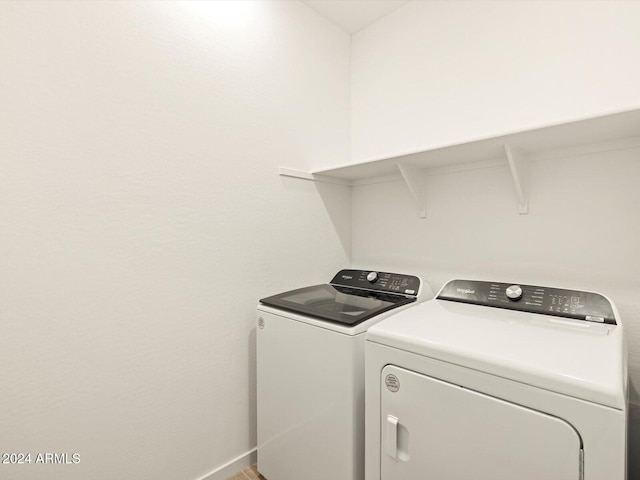 washroom with independent washer and dryer