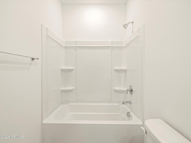 bathroom featuring  shower combination and toilet