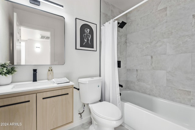 full bathroom featuring shower / tub combo with curtain, vanity, and toilet