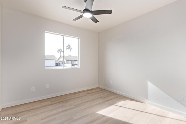 spare room featuring ceiling fan and light hardwood / wood-style flooring