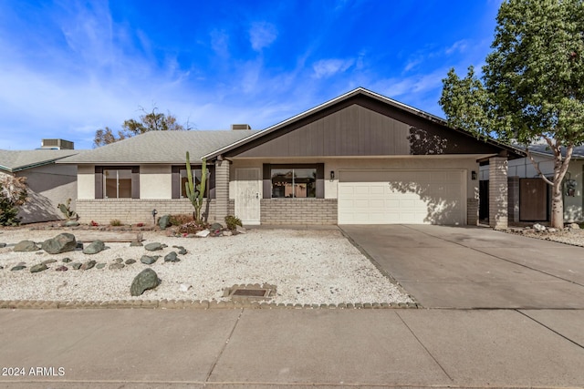 single story home with a garage