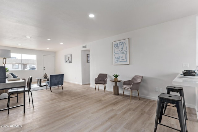 living room with light hardwood / wood-style flooring