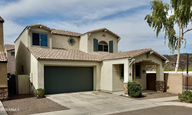 22507 N 31st Ave # 11, Phoenix, AZ 85027 - mediterranean / spanish-style home featuring stucco siding, fence, a tile roof, concrete driveway, and a gate