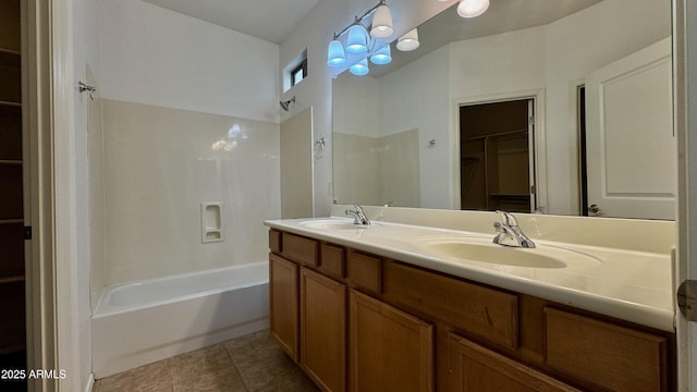 22507 N 31st Ave # 11, Phoenix, AZ 85027 - bathroom with a walk in closet, double vanity, bathing tub / shower combination, and tile patterned floors