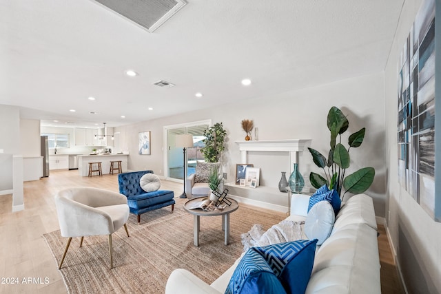 living room with light hardwood / wood-style flooring