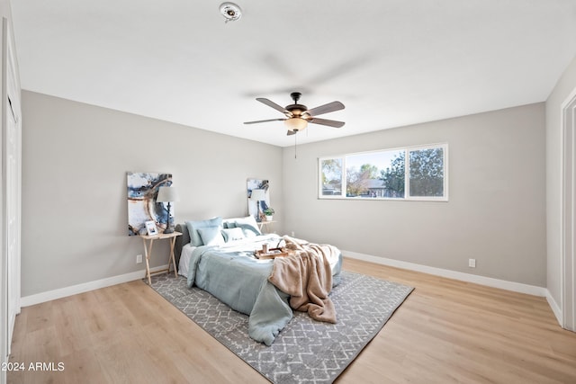 bedroom featuring ceiling fan and light hardwood / wood-style flooring