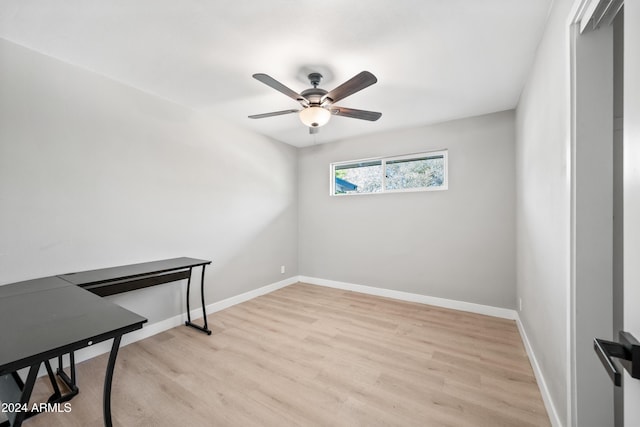 spare room featuring ceiling fan and light hardwood / wood-style flooring