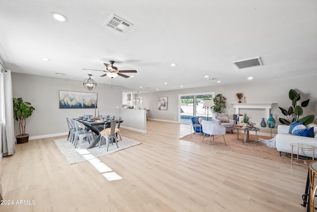 dining space featuring light hardwood / wood-style flooring and ceiling fan