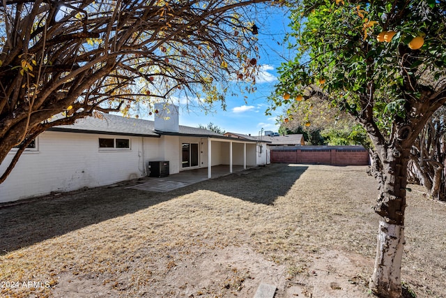 back of property with a patio and cooling unit