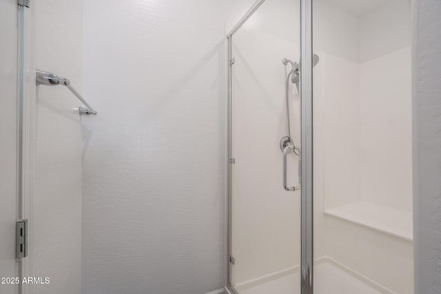 bathroom featuring an enclosed shower