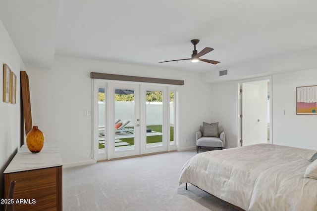 bedroom with ceiling fan, light colored carpet, access to outside, and french doors