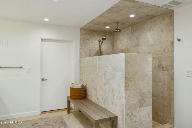 bathroom featuring a tile shower