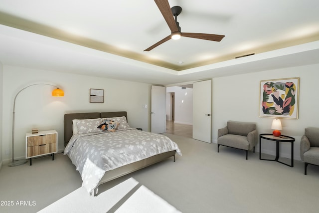 bedroom with ceiling fan and light colored carpet