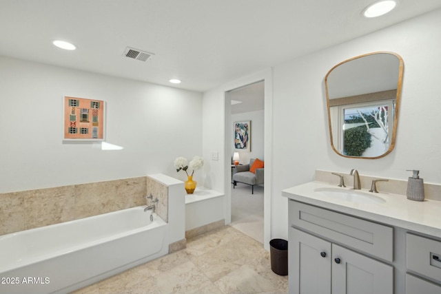 bathroom featuring a bath and vanity