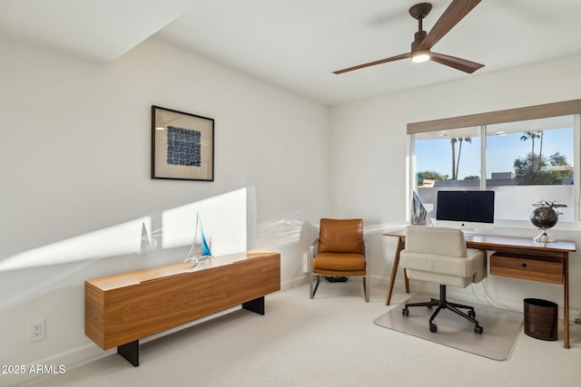 office area featuring light carpet and ceiling fan