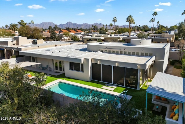 rear view of property with a patio area and a mountain view