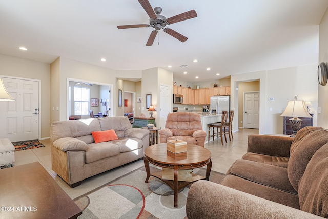 living room featuring ceiling fan and light tile patterned floors