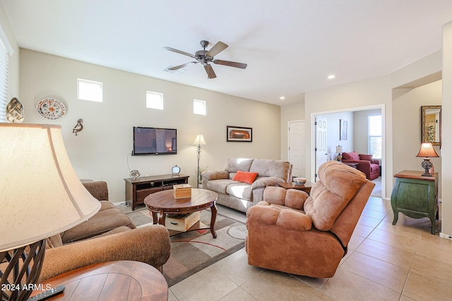 living room featuring ceiling fan and light tile patterned flooring