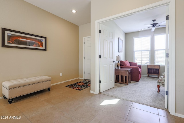 interior space featuring ceiling fan and light tile patterned floors