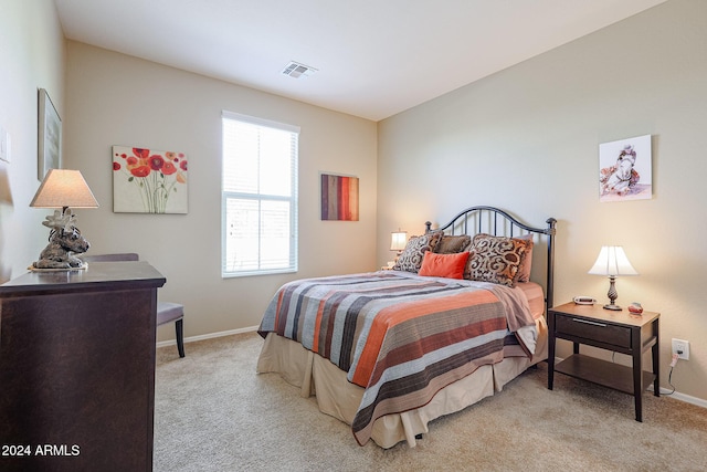 bedroom featuring light carpet