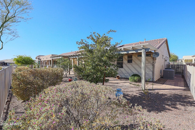 rear view of property with central air condition unit