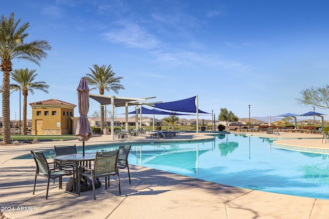 view of swimming pool featuring a patio area