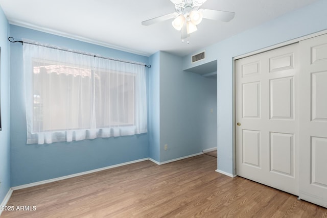 4135 E Altadena Ave, Phoenix, AZ 85028 - unfurnished bedroom with wood finished floors, a closet, and ceiling fan