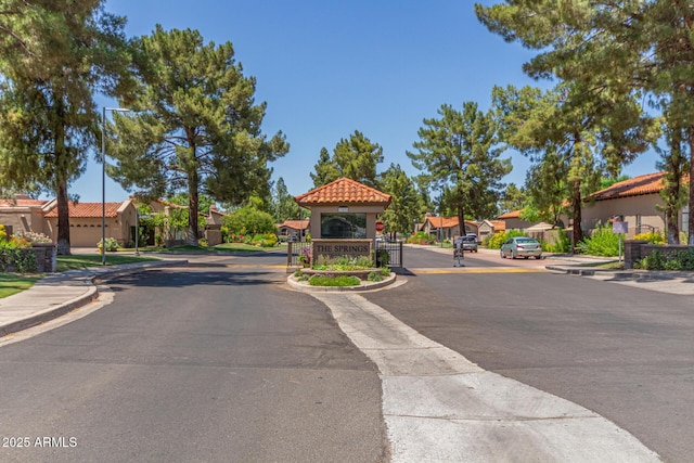 4135 E Altadena Ave, Phoenix, AZ 85028 - view of asphalt street with a residential view, curbs, sidewalks, and traffic signs