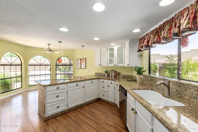 4135 E Altadena Ave, Phoenix, AZ 85028 - kitchen featuring a peninsula, dishwasher, a ceiling fan, white cabinets, and glass insert cabinets