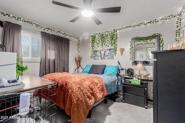 14001 N 34th Dr, Phoenix, AZ 85053 - bedroom featuring a textured ceiling, ceiling fan, and light tile patterned floors