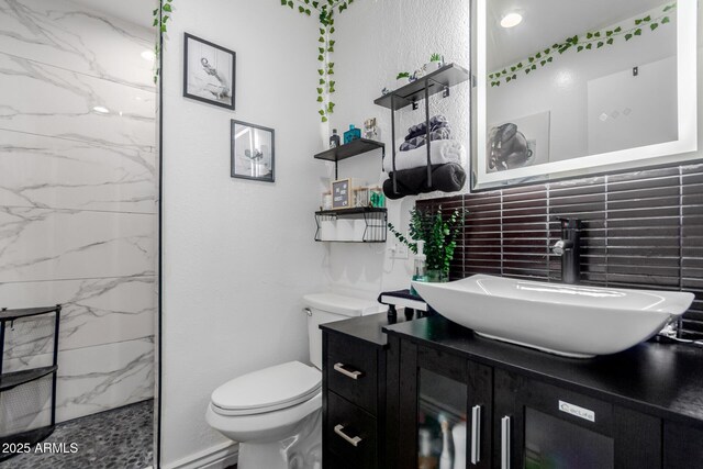 14001 N 34th Dr, Phoenix, AZ 85053 - full bath featuring vanity, toilet, a marble finish shower, and tasteful backsplash