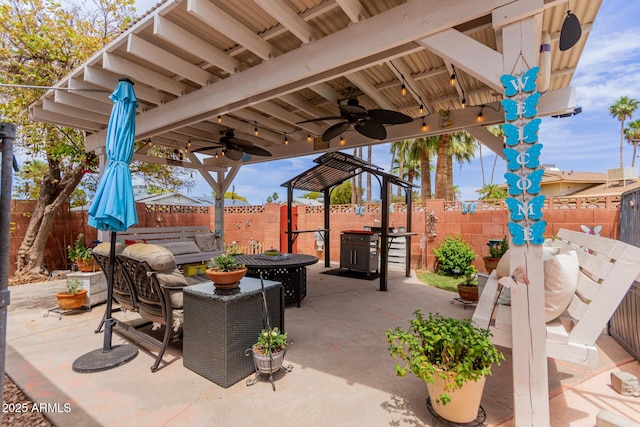 14001 N 34th Dr, Phoenix, AZ 85053 - fenced backyard with a gazebo, a ceiling fan, a patio area, and an outdoor living space
